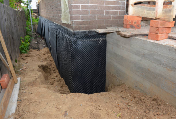 Happy homeowners after waterproofing job in Three Oaks